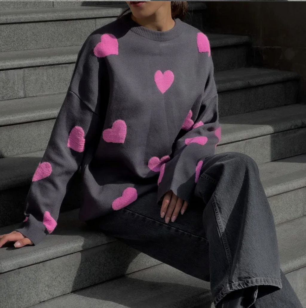 Women's knitted jumper with scattered contrasting motifs