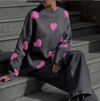 Women's knitted jumper with scattered contrasting motifs