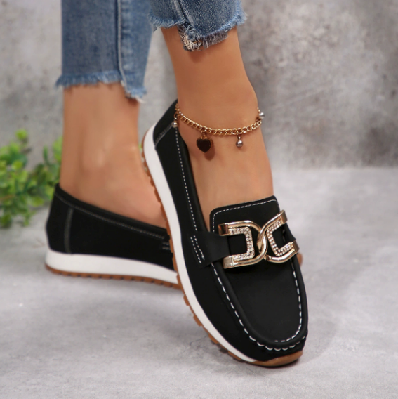 Women's slip-on loafers with moccasin stitching and decorative buckle detail