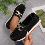 Women's slip-on loafers with moccasin stitching and decorative buckle detail