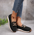 Women's slip-on loafers with moccasin stitching and decorative buckle detail