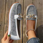 Women's flat loafers with metal buckle and moccasin stitching