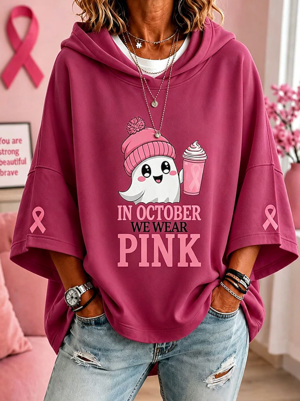 Women's hooded top with short sleeves, ghost graphic and pink ribbon sleeve details