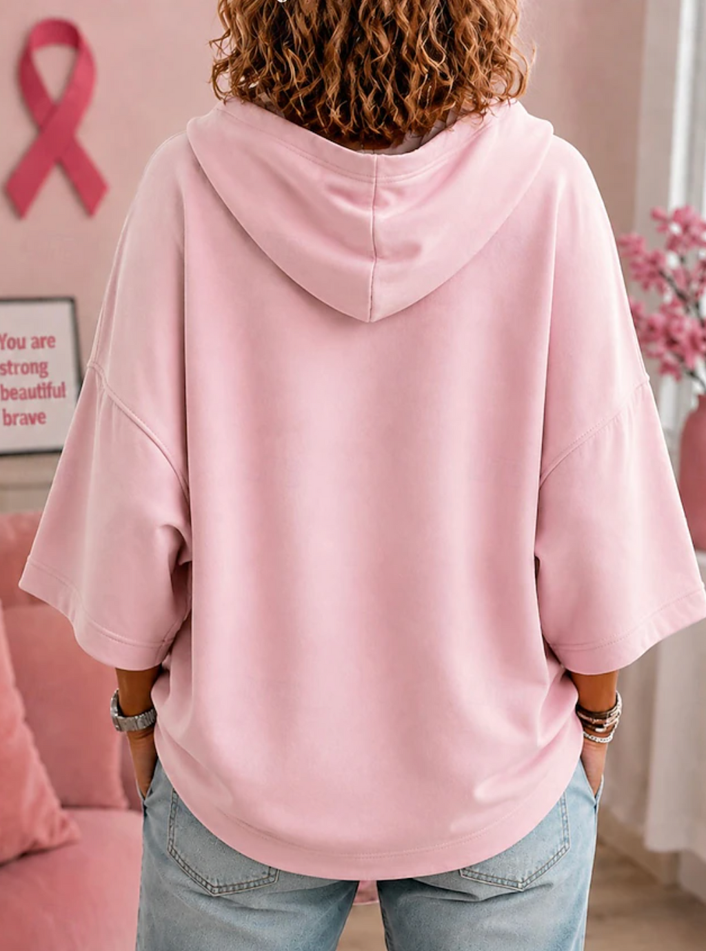 Women's hooded top with short sleeves, ghost graphic and pink ribbon sleeve details