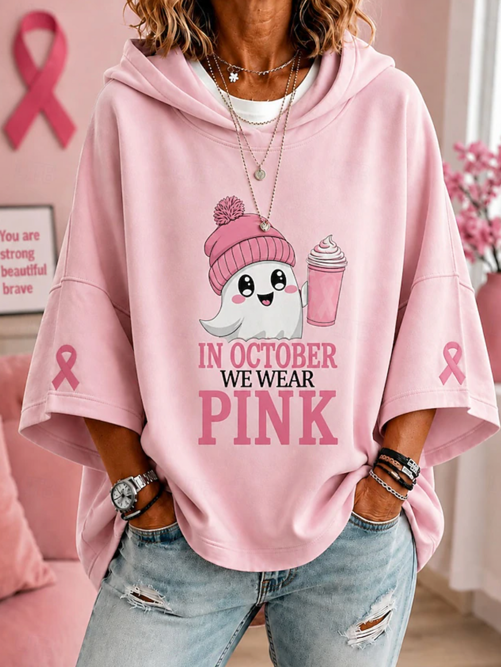 Women's hooded top with short sleeves, ghost graphic and pink ribbon sleeve details