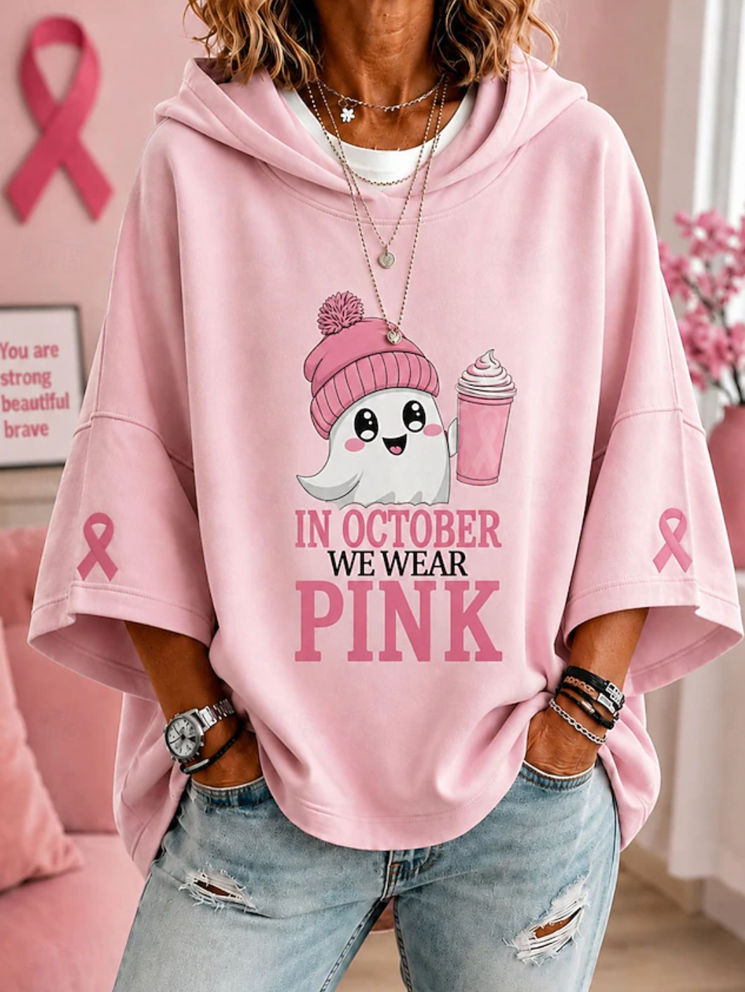 Women's hooded top with short sleeves, ghost graphic and pink ribbon sleeve details