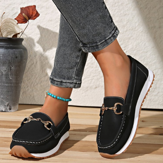 Women's flat loafers with moc toe stitching and metal buckle detail