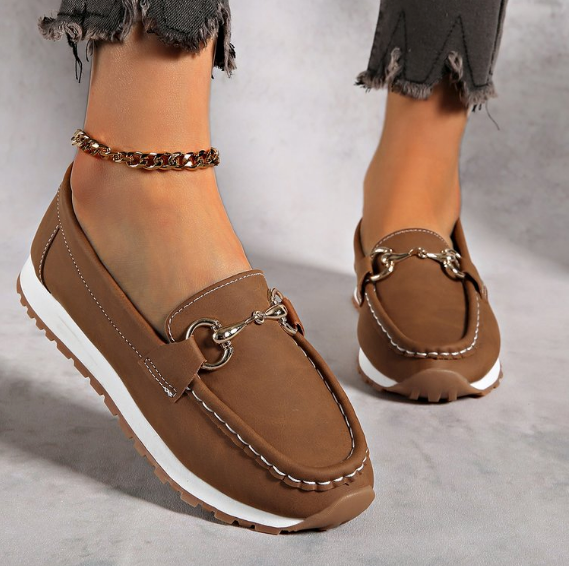 Women's flat loafers with moc toe stitching and metal buckle detail
