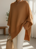 Oversized knit sweater with crew neckline and long sleeves