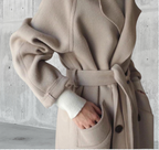 Women's long trench coat with lapels, belt and double-breasted buttons