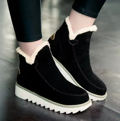 Women's ankle boots with light trim and flat ridged soles