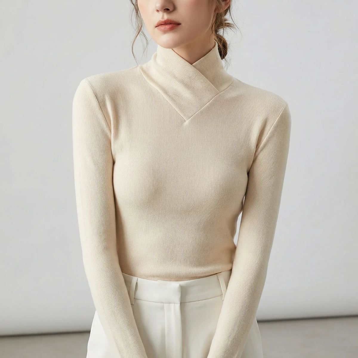 Women's fitted ribbed turtleneck sweater with crossover high neck and long sleeves