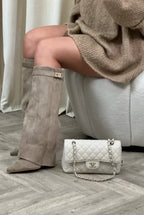 Women's tall pointed-toe heeled boots with buckle detail