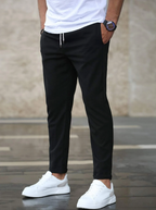 Men's tapered trousers with drawstring waist, side pockets and cuffed ankles