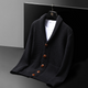 Knit cardigan with shawl collar buttons and patch pockets