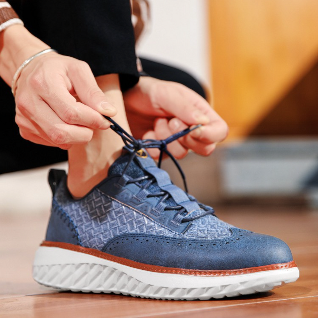 Hand-stitched sneakers with textured panels and ridged soles
