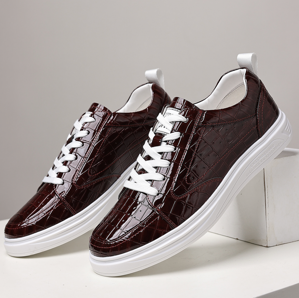 Glossy crocodile-effect trainers with white laces and platform soles