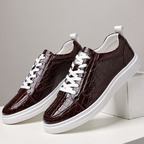 Glossy crocodile-effect trainers with white laces and platform soles