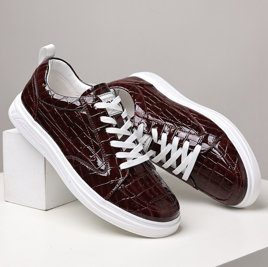 Glossy crocodile-effect trainers with white laces and platform soles