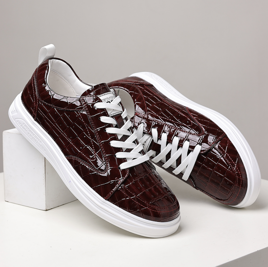 Glossy crocodile-effect trainers with white laces and platform soles