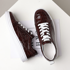 Glossy crocodile-effect trainers with white laces and platform soles