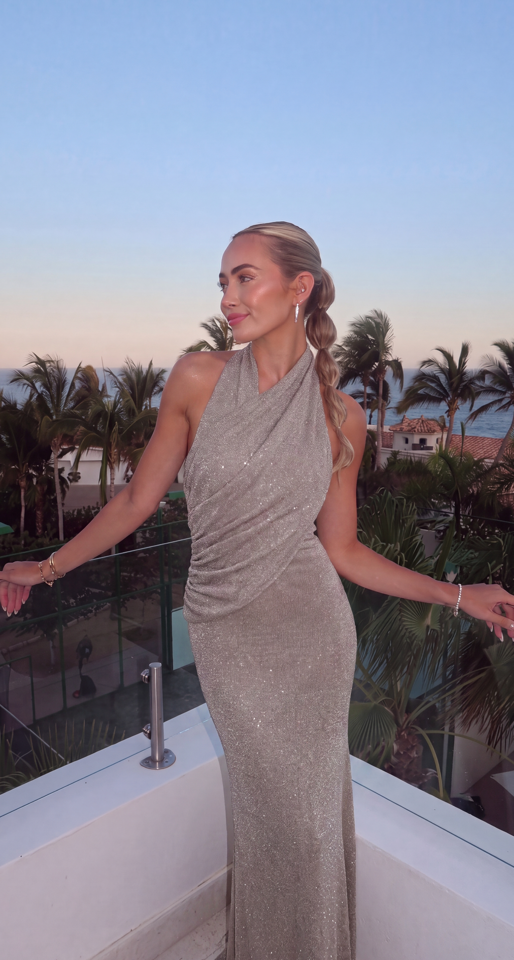 Women's silver halter maxi dress with wrap front and shimmer finish