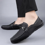 Men's slip-on loafers with moc toe stitching and metal bit detail