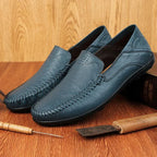 Men's slip-on leather loafers with rounded moc toe and stitched detailing