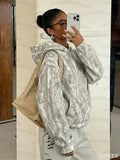 Women's oversized camouflage hoodie with hood and front kangaroo pocket