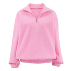 Women's pink textured pullover with stand collar and quarter-zip front