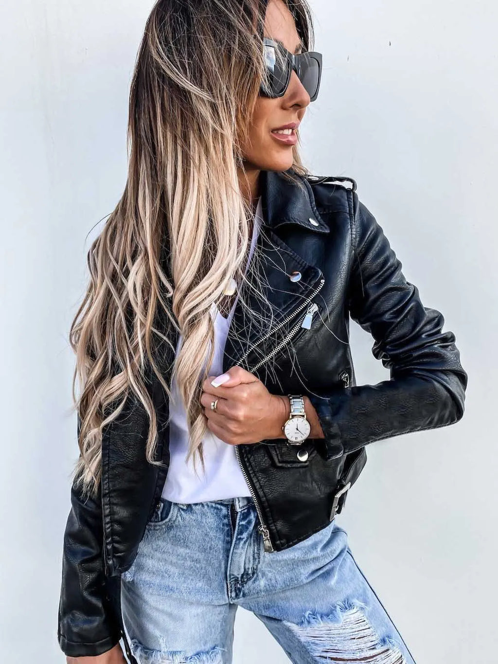 Women's cropped biker jacket with lapels, zips, studs and belted waist