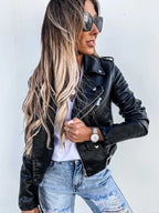 Women's cropped biker jacket with lapels, zips, studs and belted waist
