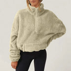 Women's textured hooded half-zip sweater with long sleeves and front pocket