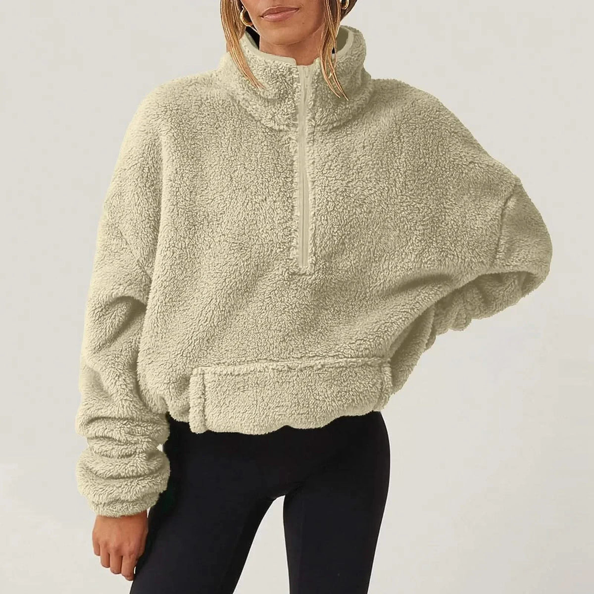 Women's textured hooded half-zip sweater with long sleeves and front pocket