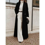 Women's long black maxi coat with notched lapels and button front