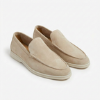 Men's slip-on loafers with stitched trim and contrast soles
