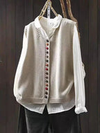 Women's sleeveless knit vest with V-neck and colorful buttons