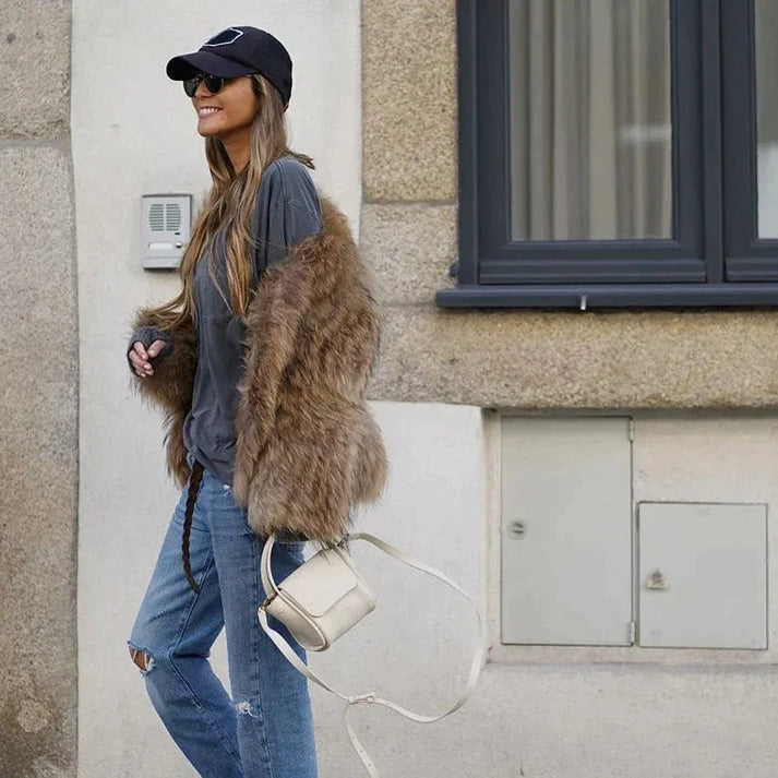 Women's brown faux fur jacket with a hooded collar