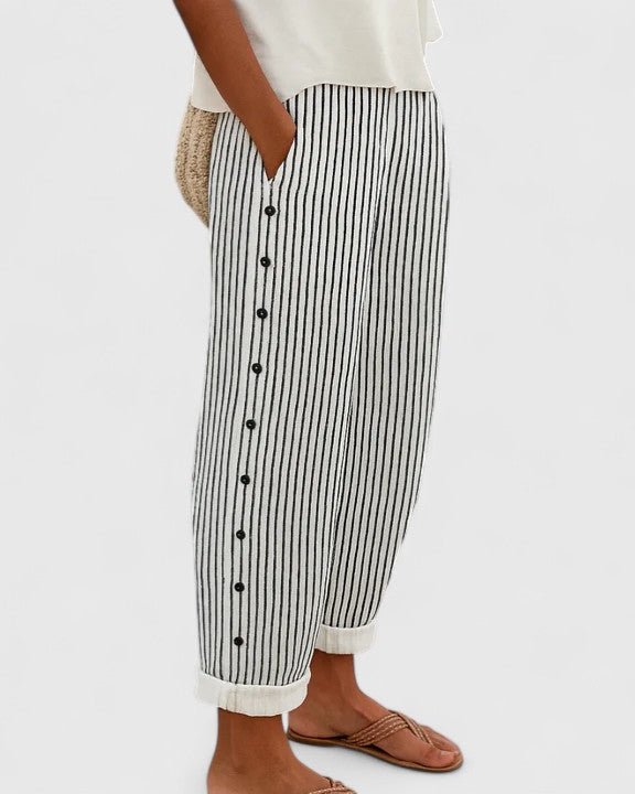 Women's striped cropped trousers with side buttons and turned cuffs