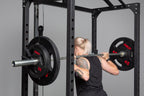 Black rubber coated Olympic weight plate marked 45 with three grip handles