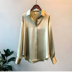 Women's long sleeve collared blouse with button front and curved hem