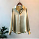 Women's long sleeve collared blouse with button front and curved hem