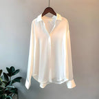 Women's long sleeve collared blouse with button front and curved hem