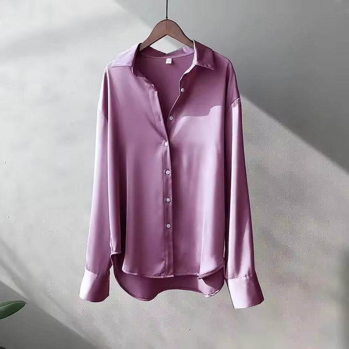 Women's long sleeve collared blouse with button front and curved hem
