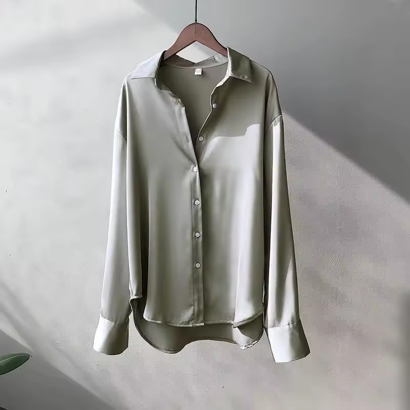 Women's long sleeve collared blouse with button front and curved hem