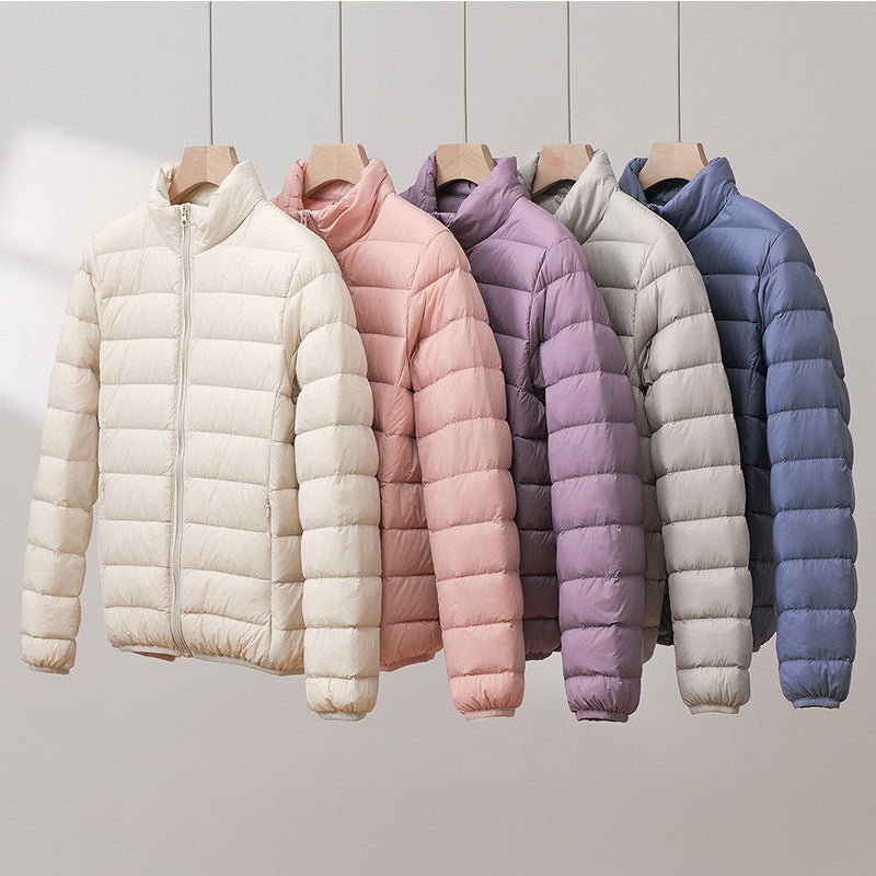 Women's quilted puffer jacket with high collar and long sleeves
