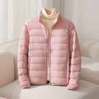 Women's quilted puffer jacket with high collar and long sleeves