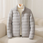 Women's quilted puffer jacket with high collar and long sleeves
