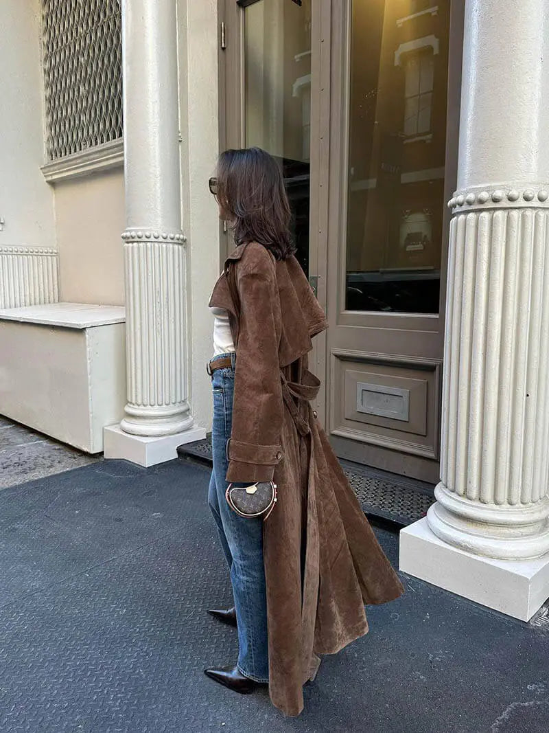 Women's brown long trench coat with contrast lapels and belted waist