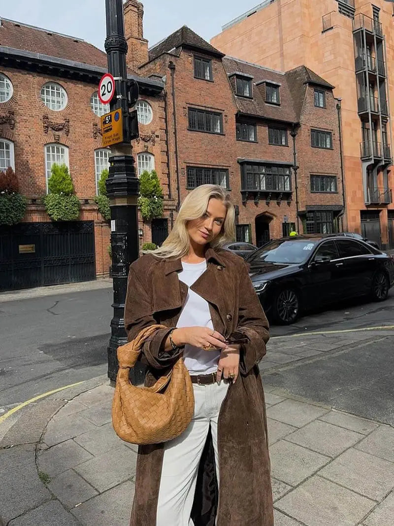 Women's brown long trench coat with contrast lapels and belted waist